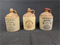group of small size advertising stoneware jugs