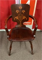 Antique wood chair with inlaid back