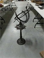 Cast iron decor piece on stand. 3 foot tall.