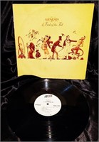 ORIG 1975 GENESIS A TRICK OF THE TAIL NO BAR CODE