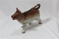 A Ceramic Cow Container