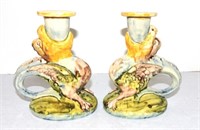 Pair of majolica style griffin candle holders,