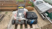 Husqvarna Push Mower and Gas Cans