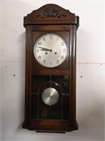 Wooden Wall clock with key, overwound.