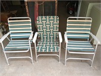 Three aluminum bodied folding lawn chairs