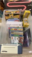 Small tub lot with games, toys, smiley face wrist