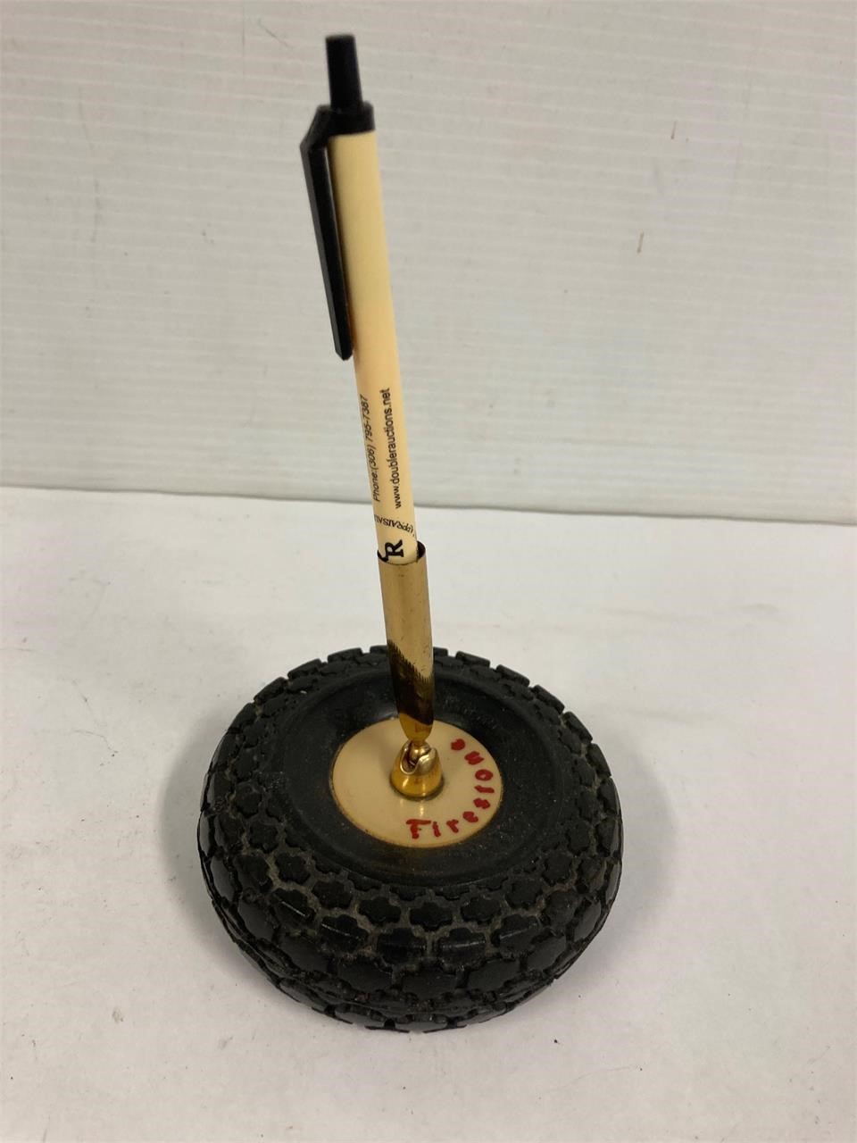 Firestone tire pen holder.