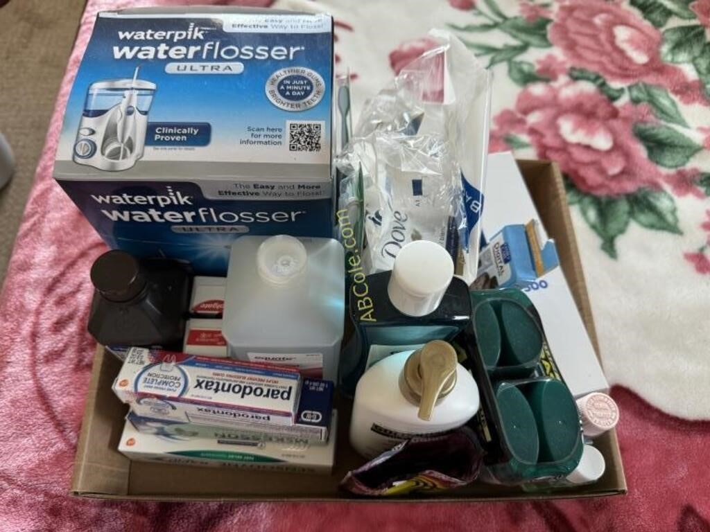 Box with: Waterpick water flosser Ultra (new in