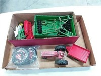 assortment of toy tractor parts