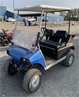 Gas powered club car with a lift and bigger tires