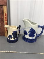 2 pitchers w/designs