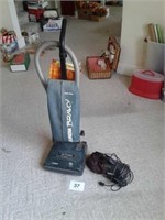 Upright Eureka vacuum and a hand-held Dirt Devil