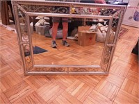 Beveled wall mirror with decorative frame and