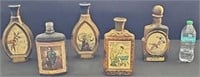 variety of Jim Beam art whiskey decanters