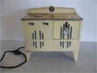 Vintage child's Empire electric tin stove.