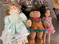 Three assorted dolls