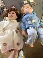 Two large baby dolls, 1 rubber,1 porcelain
