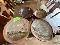 A collection of four pottery platters.  18.  15.