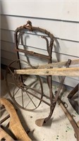 Antique wood and iron garden plow, with the