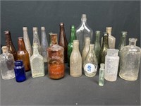 Collection of bottles, most notably, Cook and