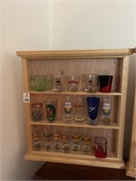 Shelf Full of Shot Glasses