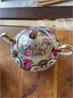 Hand painted sugar bowl with lid and creamer. The