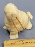 2 1/2" x 1 1/2" fossilized ivory carving of a walr