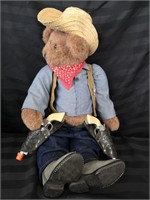 Sheriff the teddy bear with his boots and pistols