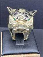Panther face ring with green eyea.