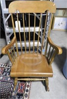Maple spindle back open arm rocking chair
