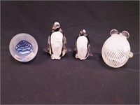 Four paperweights: three are figural including