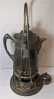 Antique silver plated tilting pitcher with stand.