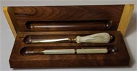 Vintage pen and letter opener in wooden box. Gold