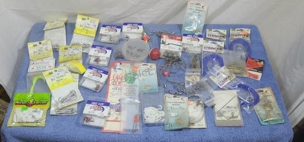 Assorted fishing lures and other items.