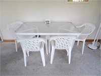 32" x 53" Glass Top Table & 4 Plastic Chairs