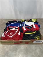 Assortment of soccer jerseys and shirts, all are