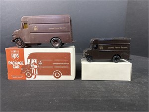 One plastic the other diecast metal UPS trucks