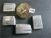 4 Lighters & Metal Piece