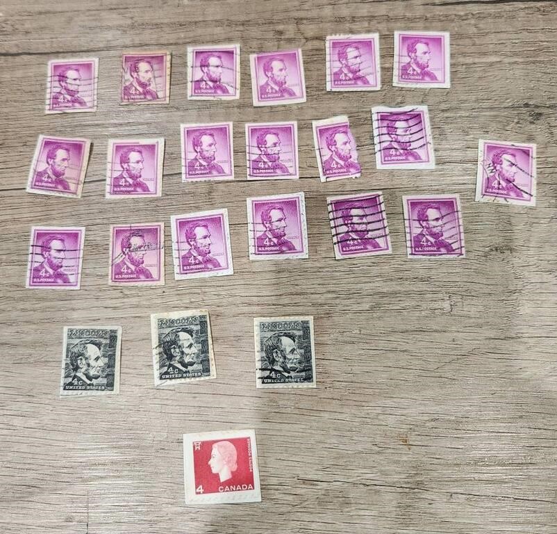Lincoln 4 cent stamps & 1 Canadian stamp
