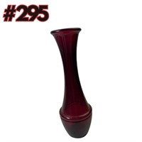 A vintage ruby glass bud vase with ribbed base