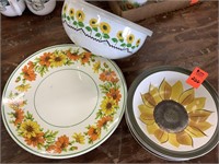 Misc sunflower dishes, mixing bowls.