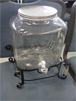 Glass water decanter on stand