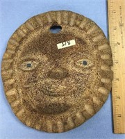6 1/2" x 7" fossilized whale bone disk, relief car