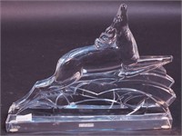 A crystal Art Deco paperweight of leaping