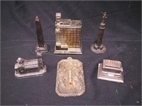 Six metal souvenir items: Washington Monument,