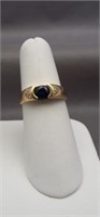 14K Yellow gold ring with dark blue center stone