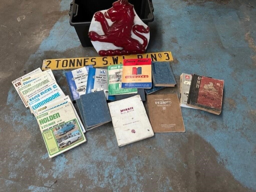 Assorted car manuals, Holden books & Peogot sign