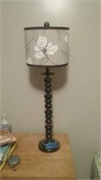 Beautiful grayish metal lamp with flower shade
