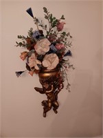 Cherub sconce with flowers, 26 inches tall.