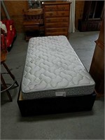 Twin size mattress and frame with storage.